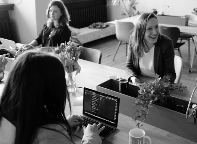 three people in an office